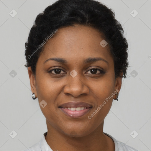 Joyful black young-adult female with short  black hair and brown eyes