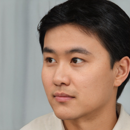 Neutral asian young-adult male with short  black hair and brown eyes