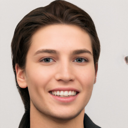 Joyful white young-adult female with medium  brown hair and grey eyes