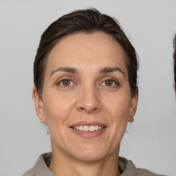 Joyful white adult female with short  brown hair and brown eyes