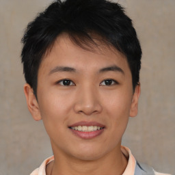 Joyful asian young-adult male with short  brown hair and brown eyes