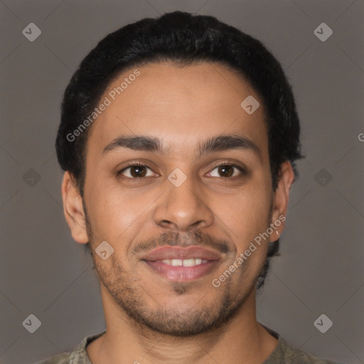 Joyful latino young-adult male with short  black hair and brown eyes