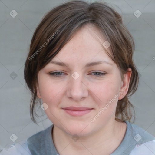 Joyful white young-adult female with medium  brown hair and blue eyes