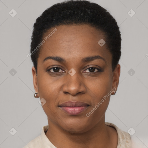 Joyful black young-adult female with short  black hair and brown eyes