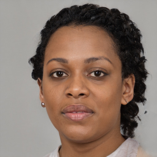 Neutral black adult female with short  black hair and brown eyes