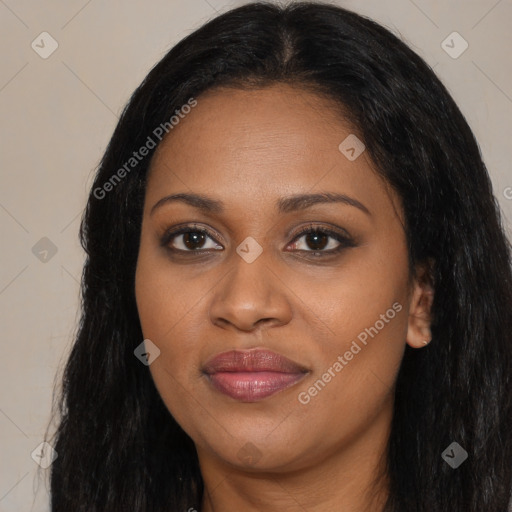 Joyful black young-adult female with long  black hair and brown eyes