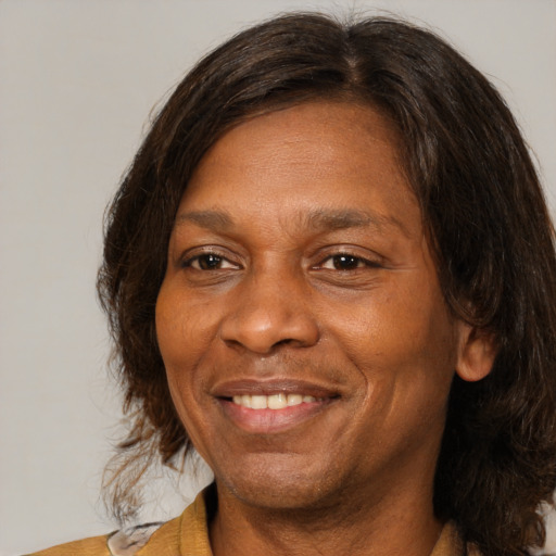 Joyful white adult female with medium  brown hair and brown eyes