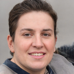 Joyful white adult female with short  brown hair and grey eyes