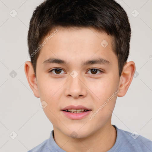 Joyful white child male with short  brown hair and brown eyes