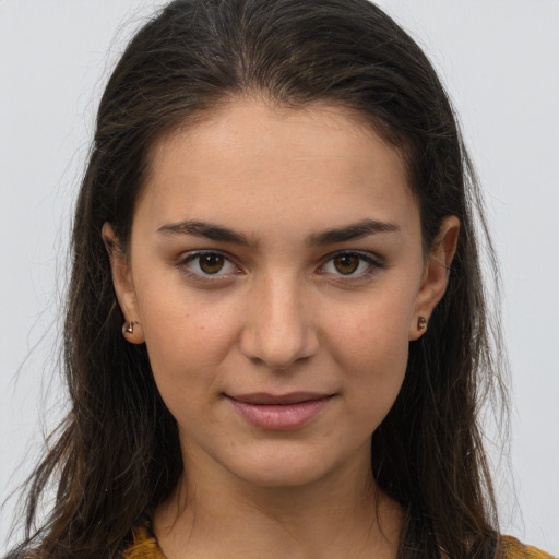 Joyful white young-adult female with long  brown hair and brown eyes