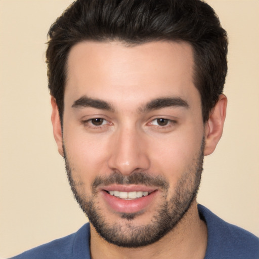 Joyful white young-adult male with short  black hair and brown eyes