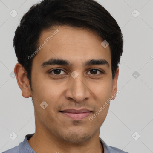 Joyful latino young-adult male with short  brown hair and brown eyes