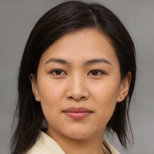 Joyful asian young-adult female with medium  brown hair and brown eyes