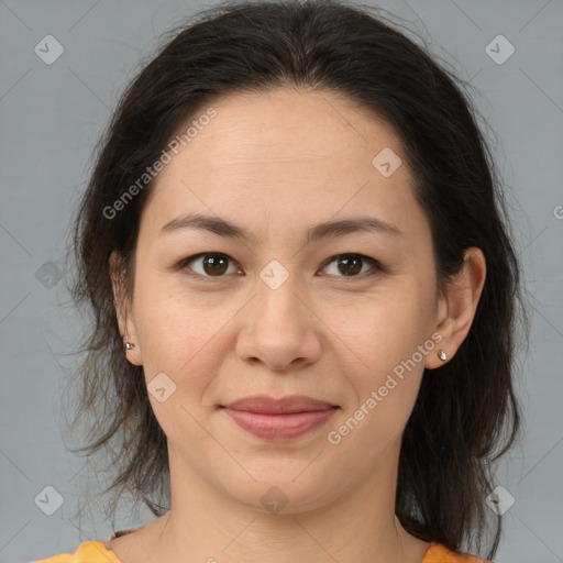 Joyful white adult female with medium  brown hair and brown eyes