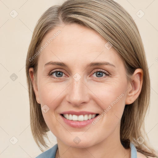 Joyful white young-adult female with medium  brown hair and blue eyes