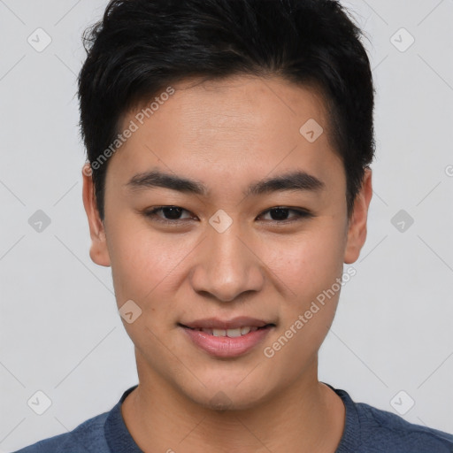 Joyful asian young-adult male with short  brown hair and brown eyes