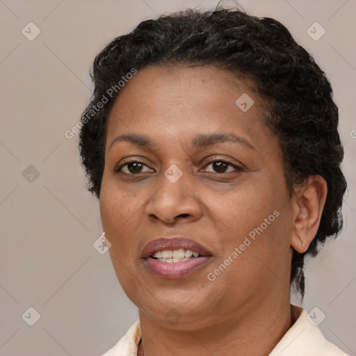 Joyful black adult female with short  brown hair and brown eyes