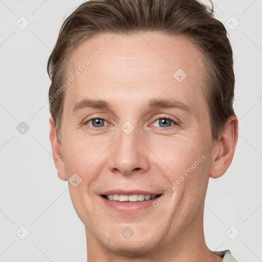 Joyful white adult male with short  brown hair and grey eyes