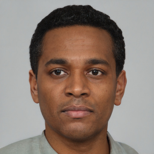 Neutral black young-adult male with short  black hair and brown eyes