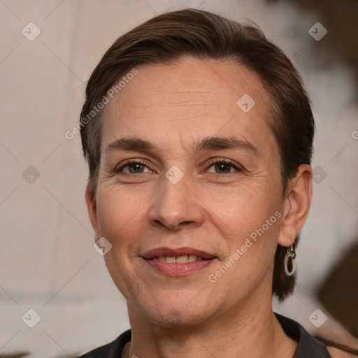 Joyful white adult female with short  brown hair and brown eyes