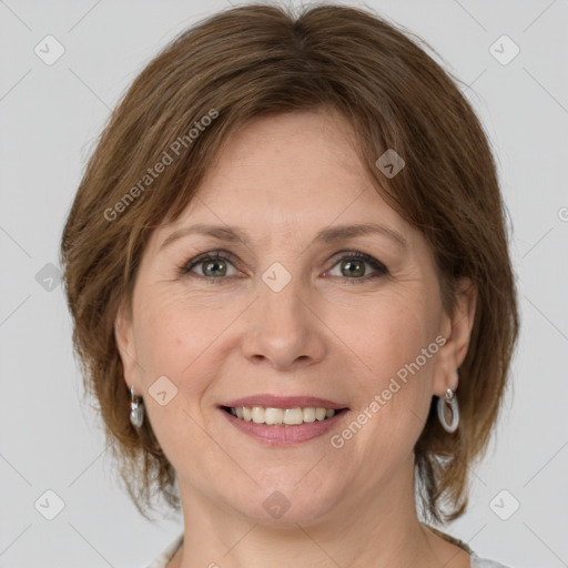 Joyful white adult female with medium  brown hair and grey eyes