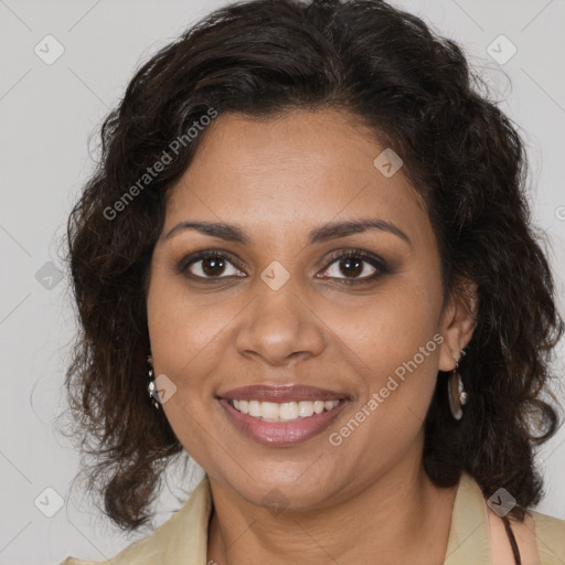 Joyful black adult female with medium  brown hair and brown eyes