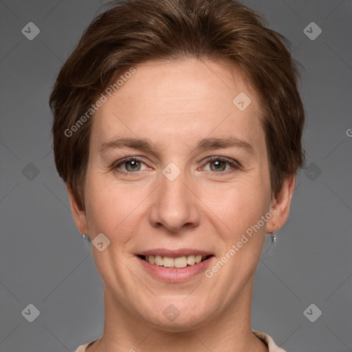 Joyful white adult female with short  brown hair and grey eyes