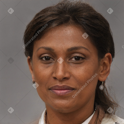 Joyful black adult female with short  brown hair and brown eyes