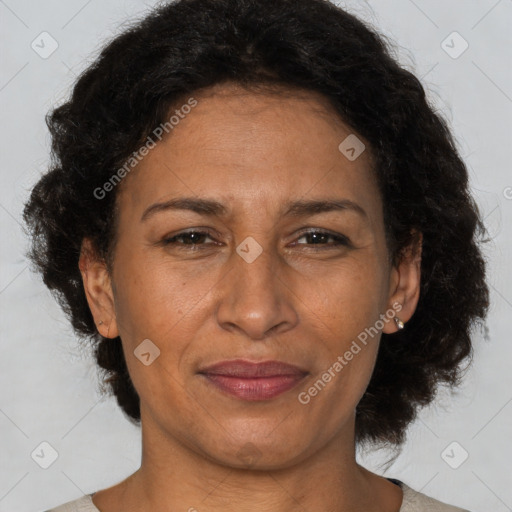 Joyful latino adult female with short  brown hair and brown eyes