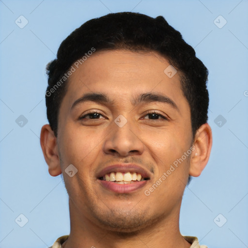 Joyful latino young-adult male with short  black hair and brown eyes