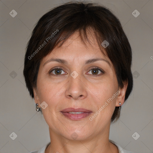 Joyful white adult female with short  brown hair and brown eyes