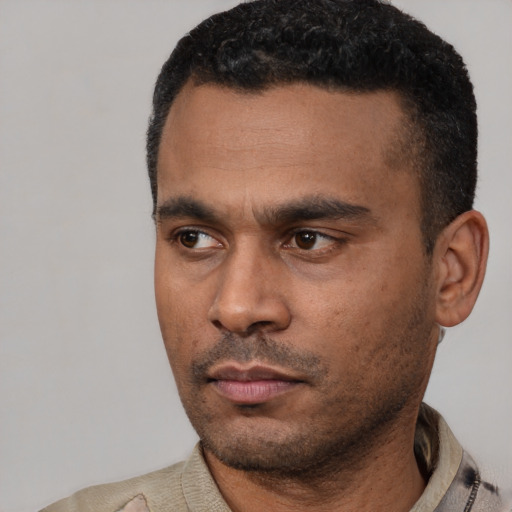 Neutral latino young-adult male with short  black hair and brown eyes