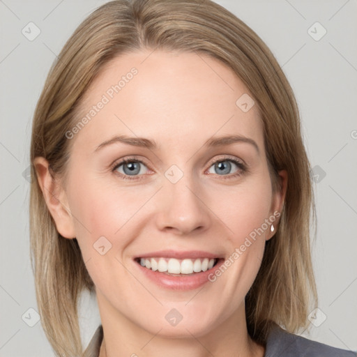 Joyful white young-adult female with medium  brown hair and blue eyes