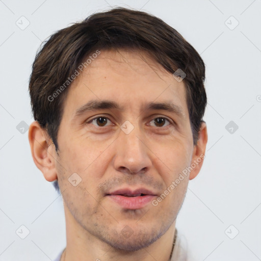 Joyful white adult male with short  brown hair and brown eyes