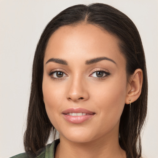 Joyful white young-adult female with long  brown hair and brown eyes