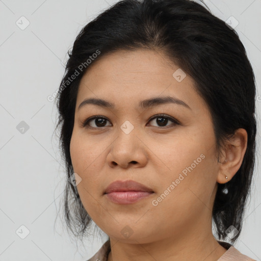 Joyful asian young-adult female with medium  brown hair and brown eyes