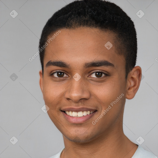 Joyful black young-adult male with short  brown hair and brown eyes