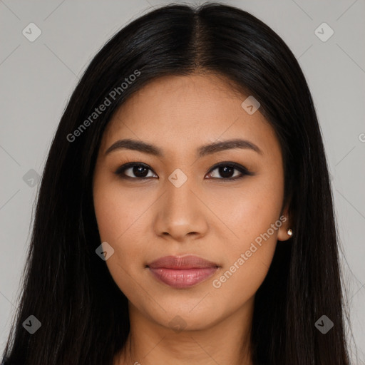 Joyful latino young-adult female with long  black hair and brown eyes