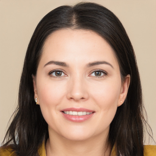 Joyful white young-adult female with long  brown hair and brown eyes