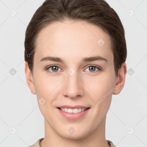 Joyful white young-adult female with short  brown hair and grey eyes