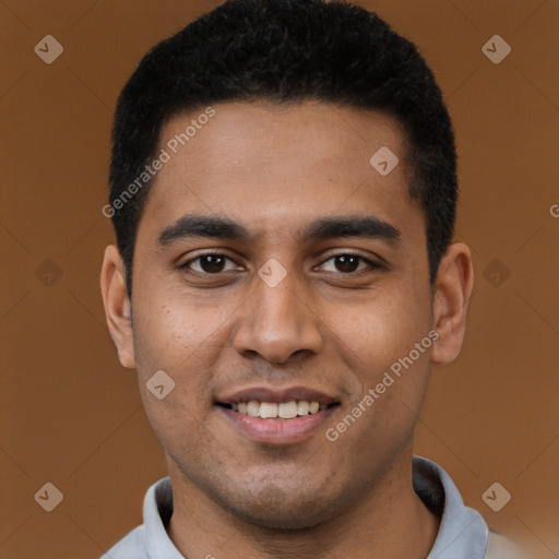 Joyful black young-adult male with short  brown hair and brown eyes