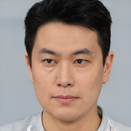 Neutral asian young-adult male with short  brown hair and brown eyes