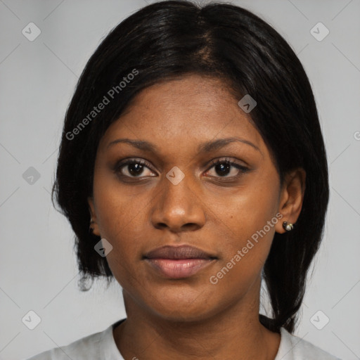 Joyful black young-adult female with medium  black hair and brown eyes