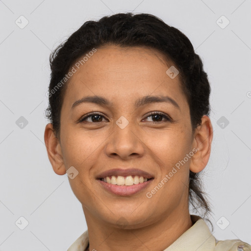 Joyful latino young-adult female with short  brown hair and brown eyes