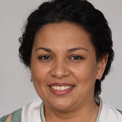 Joyful white adult female with short  brown hair and brown eyes