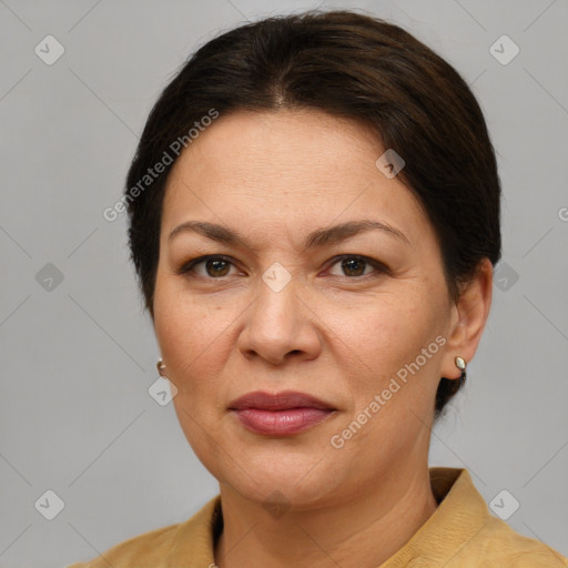 Joyful white adult female with short  brown hair and grey eyes