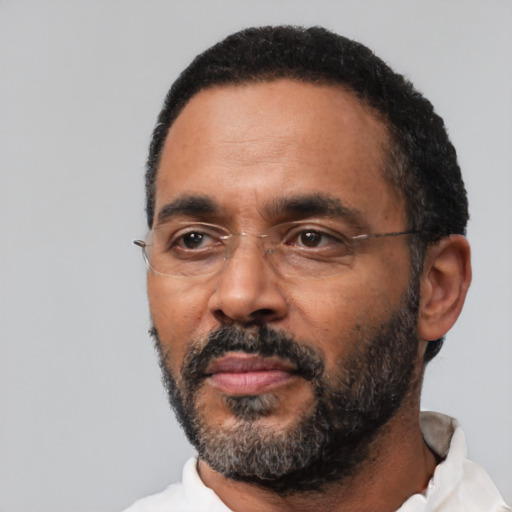 Neutral black adult male with short  black hair and brown eyes