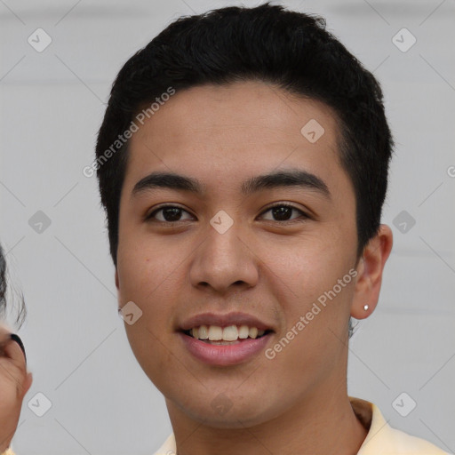 Joyful latino young-adult male with short  brown hair and brown eyes