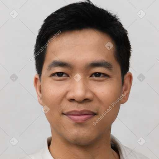 Joyful asian young-adult male with short  black hair and brown eyes