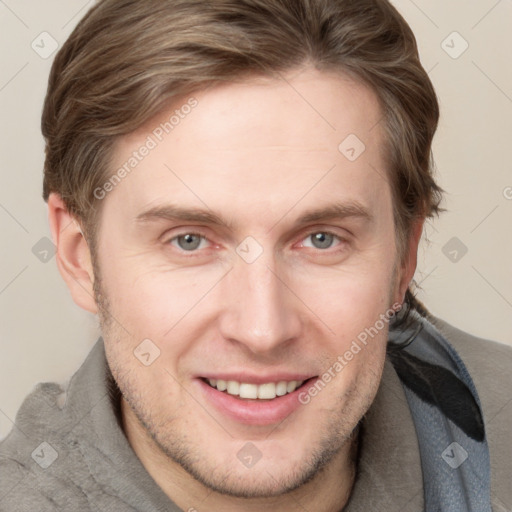 Joyful white adult male with short  brown hair and grey eyes